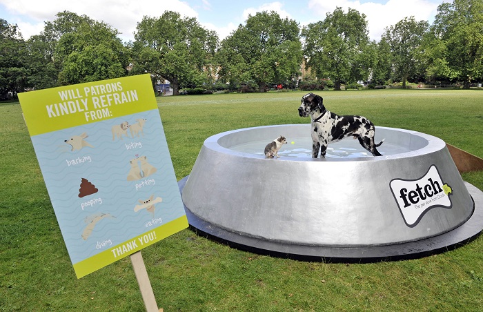Fetch.co.uk, OcadoÕs online pet store, has built what could be the worldÕs largest dog bowl in London's Kennington Park, in a bid to educate the country about keeping our dogs hydrated in the summer. The giant dog bowl in London's Kennington Park, made by Fetch.co.uk, stretches 4.5m in diameter, stands at 1m tall and can hold up to 2000 litres of water, providing an ample thirst quencher for pooches this summer. For more info fetch@manifest.london 0203 137 9270 This photo may only be used in for editorial reporting purposes for the contemporaneous illustration of events, things or the people in the image or facts mentioned in the caption. Re-use of the picture may require further permission from the copyright holder. Photo credit should read: Adrian Brooks/Imagewise
