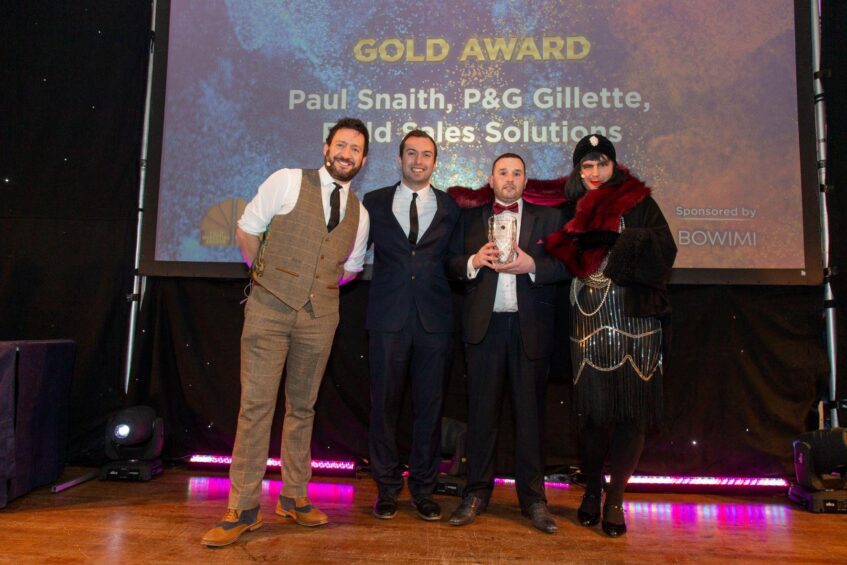Daniel Ghandimi, Bowimi, presents the award to Paul Snaith